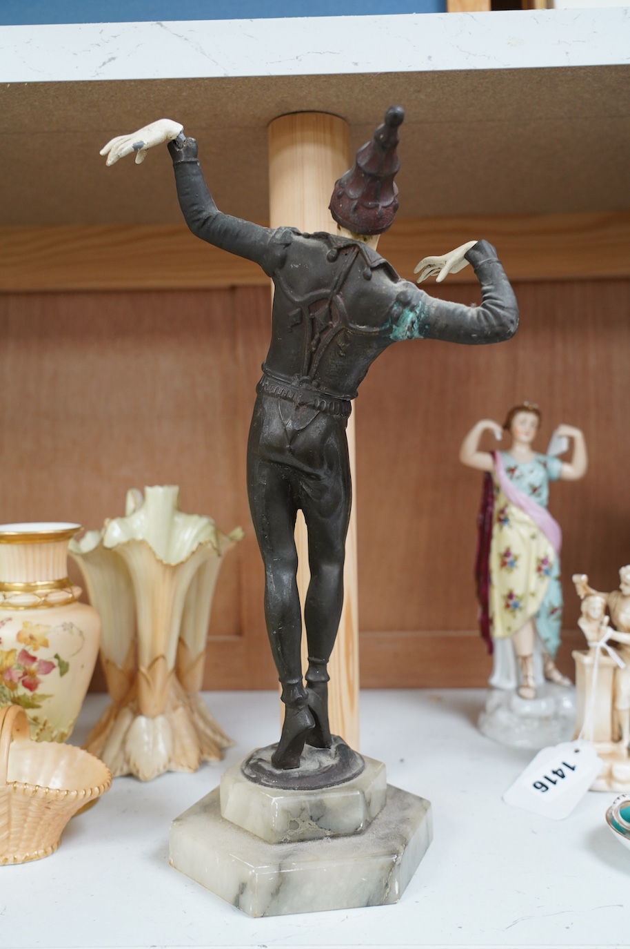 An Art Deco resin and patinated spelter model of a dancer on onyx base, 30cm. Condition - poor